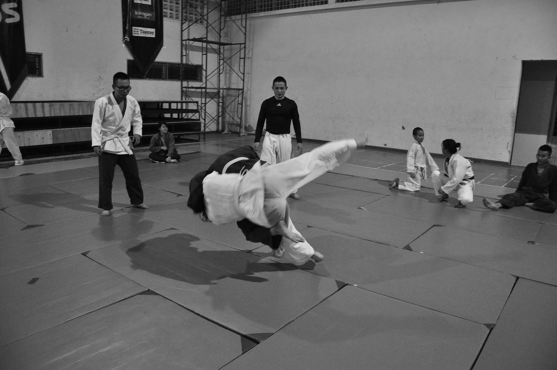 Athletes wearing custom judo gis on the mat