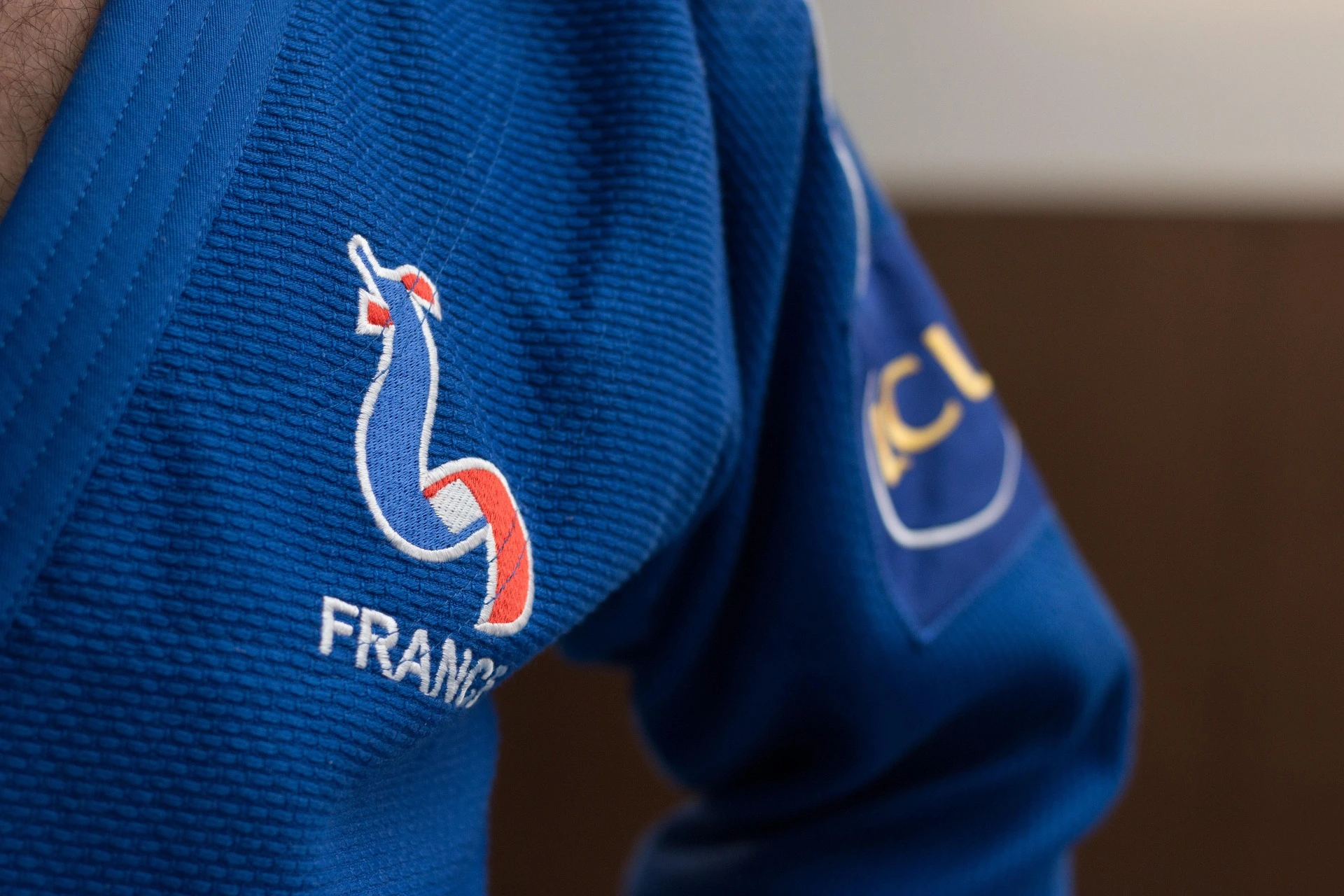Athlete wearing custom blue judo gi